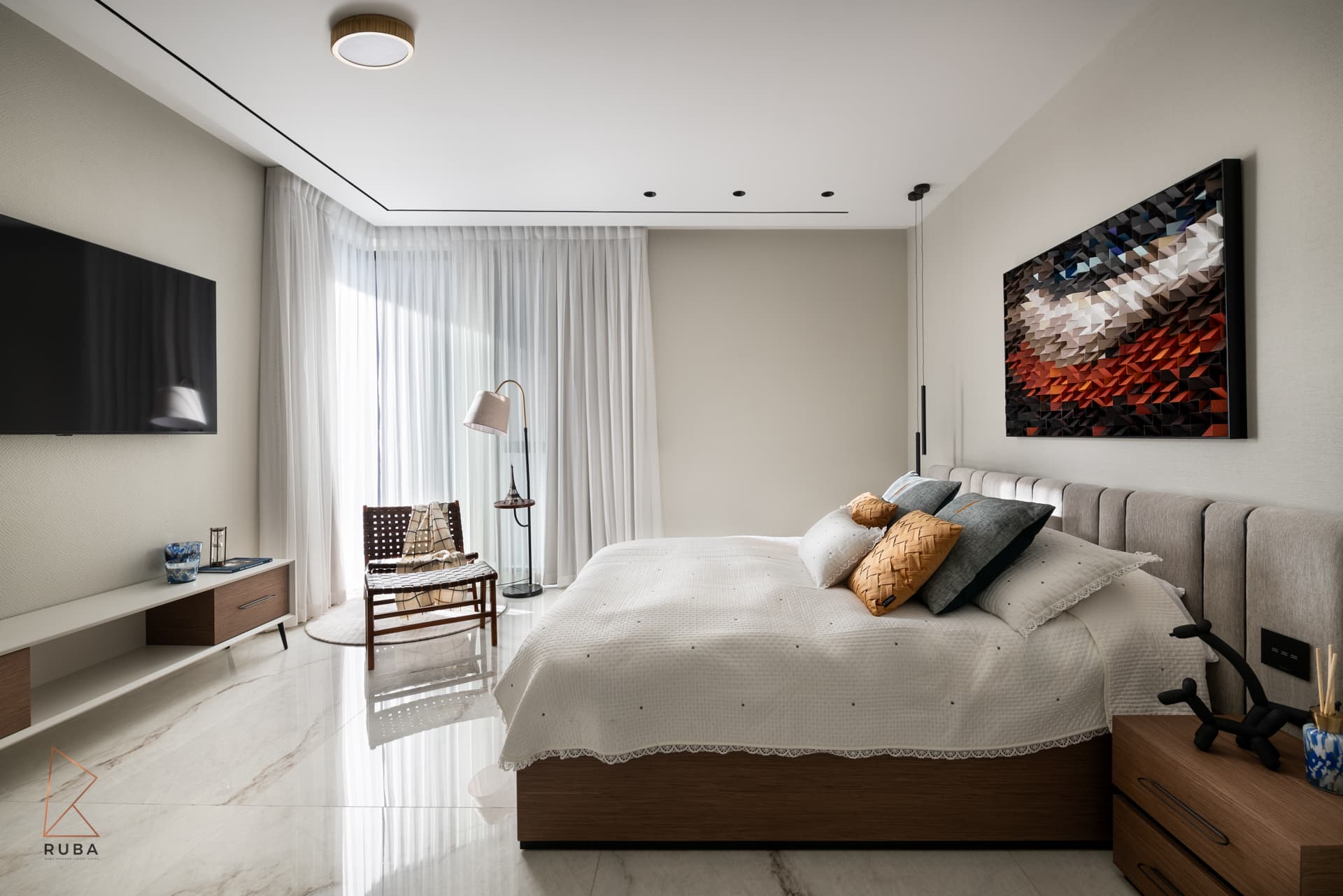 Second bedroom with a channelled grey headboard, a textured wood mosaic artwork and a reading corner by sheers in Bird of Paradise Flower