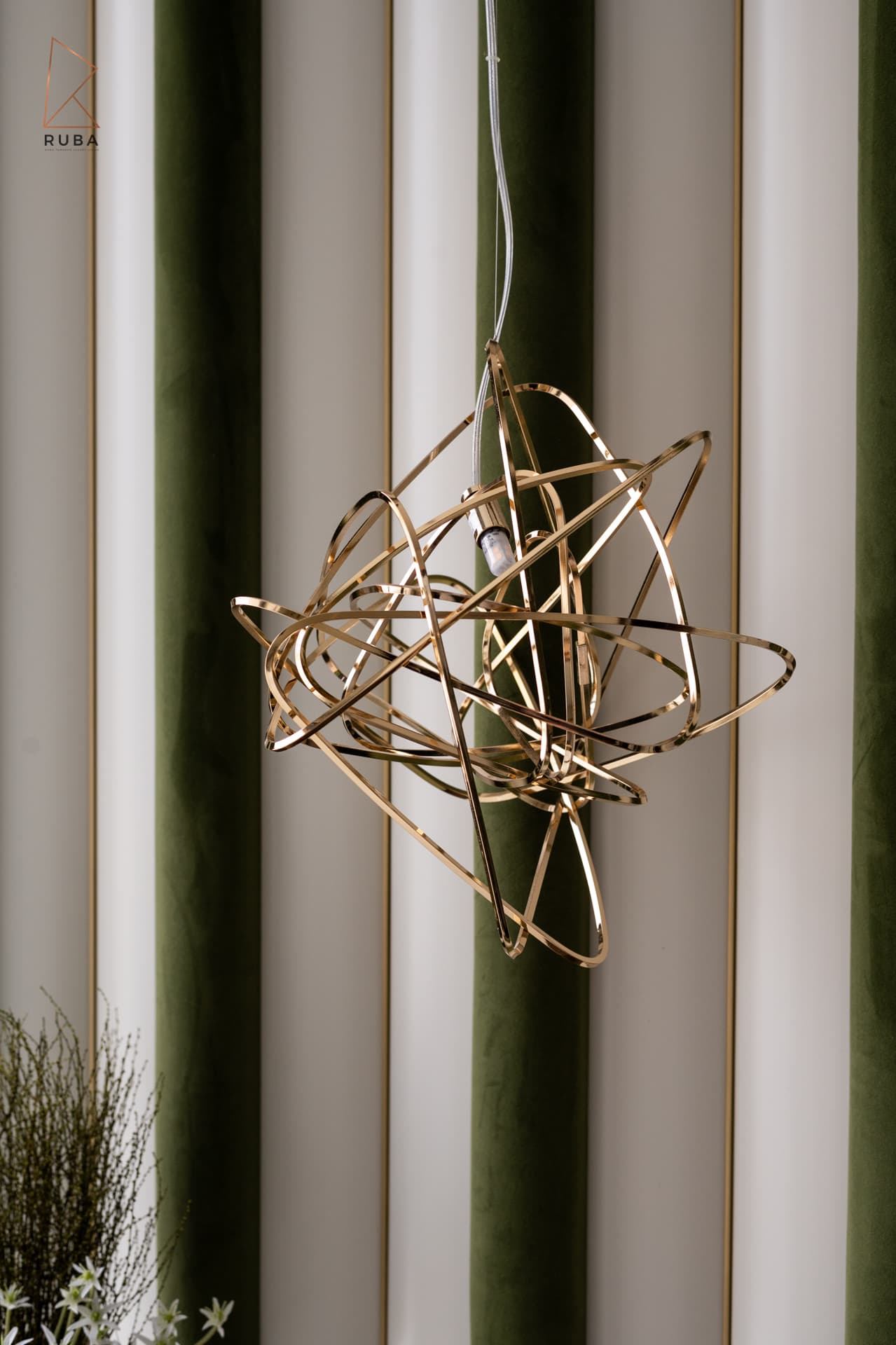 Gold wire pendant light against striped green velvet and cream wall panels in the master bedroom of Bird of Paradise Flower