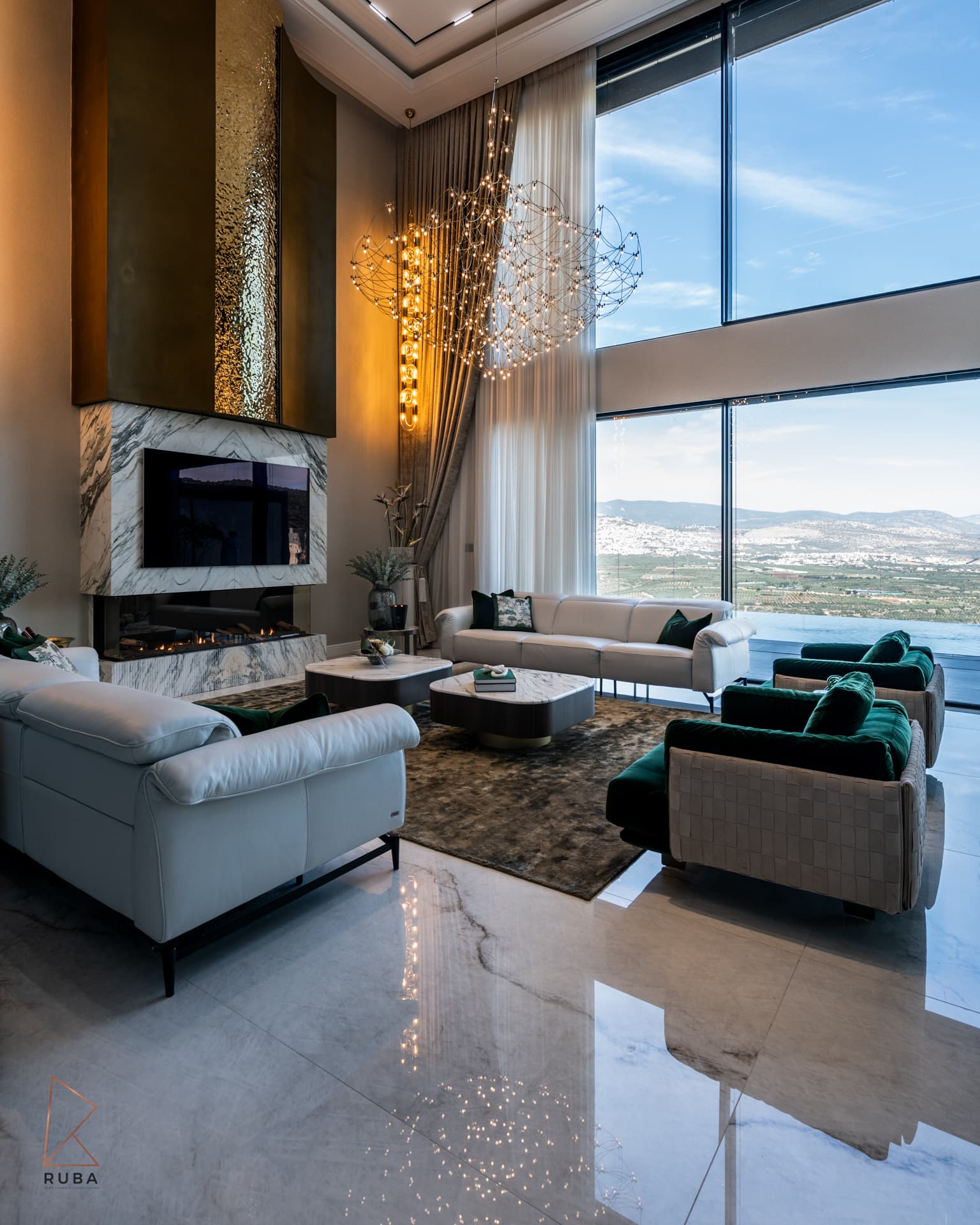 Corner view of the living room with white sofas, a dark shag rug and floor-to-ceiling windows in Bird of Paradise Flower
