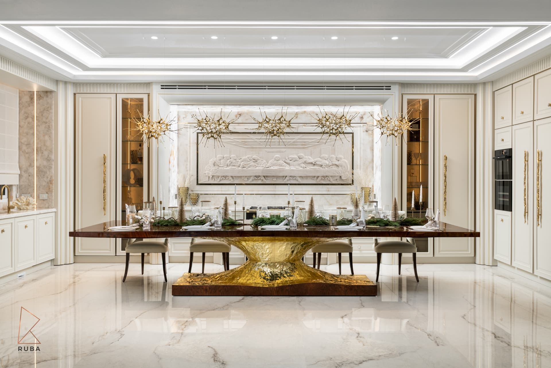 Dining table with chairs pulled back to reveal its sculpted gold base under a row of starburst chandeliers in The Last Supper