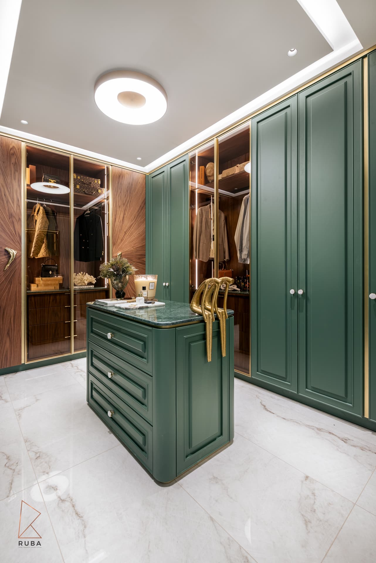 Dressing room with forest-green panelled wardrobes, a central island and glass-front walnut closets in The Last Supper