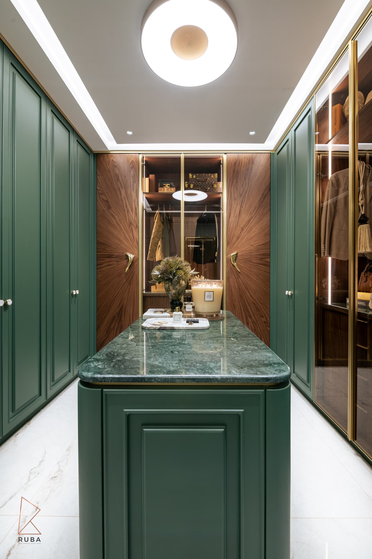 Symmetrical view of the green dressing room island with a green marble top facing a sunburst walnut wall in The Last Supper